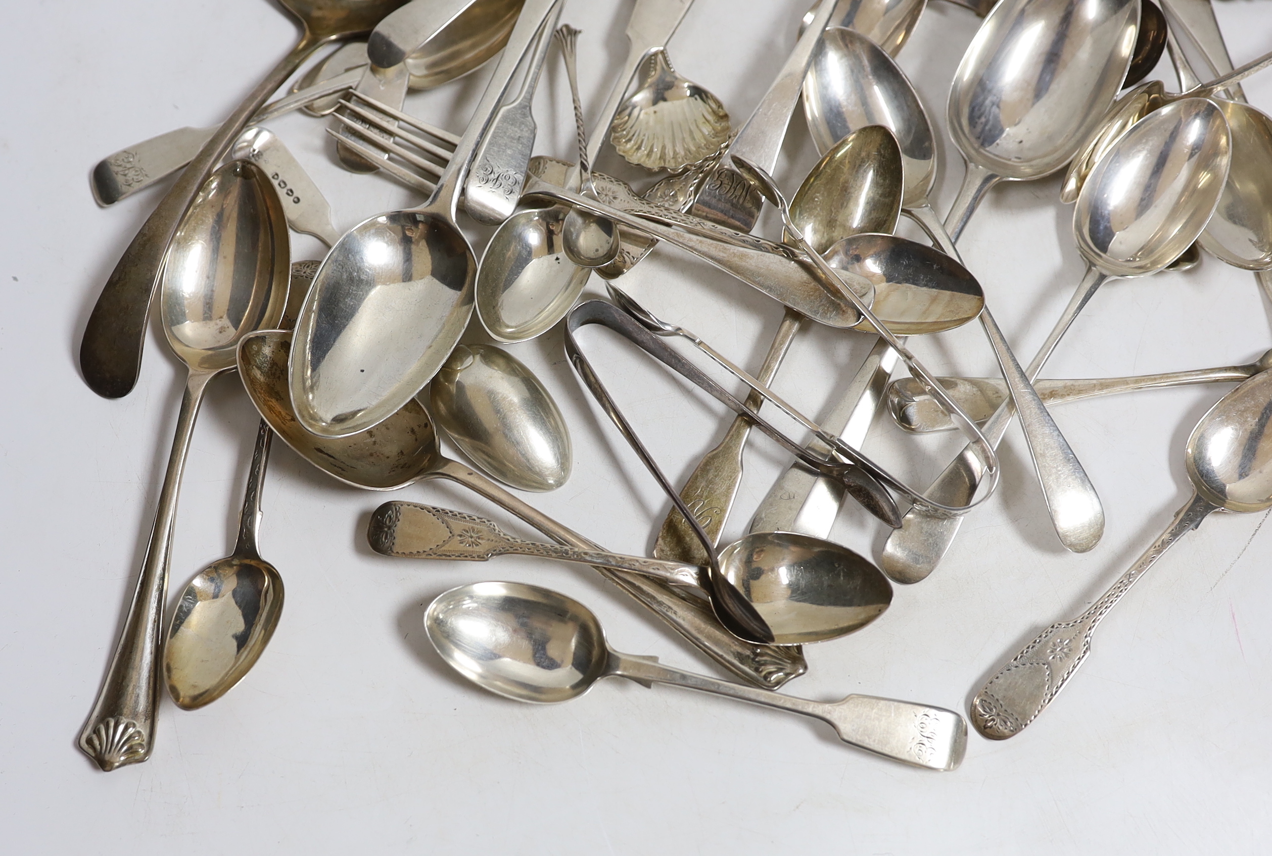 A quantity of assorted 19th century and later silver flatware, various patterns, dates and makers, including a set of silver bright cut engraved fiddle pattern teaspoons, 1843 and a Newcastle caddy spoon